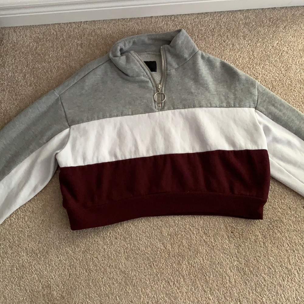 Women’s cropped sweater that has been worn once.